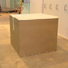 Caisse carton dans un conteneur souple